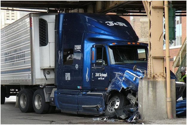 A blue semi-truck crashed into a metal pillar under a bridge in Philadelphia, sustaining significant front-end damage. For those involved, consulting with a Philadelphia car accident lawyer can provide essential guidance and support.