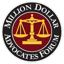 Logo of the Million Dollar Advocates Forum; features a golden balance scale on a red circle with text "Million Dollar Advocates Forum" around it.
