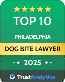 A green badge displays "Top 10 Philadelphia Dog Bite Lawyer 2025" with five stars and the TrustAnalytica logo at the bottom.