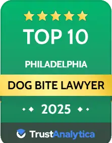A green badge displays "Top 10 Philadelphia Dog Bite Lawyer 2025" with five stars and the TrustAnalytica logo at the bottom.